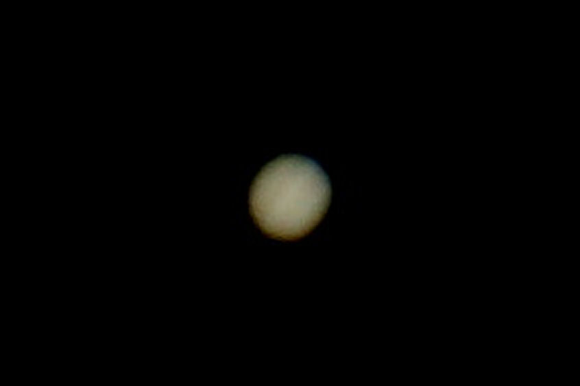 Jupiter  By Bill Samson  First (and possibly last) attempt at prime focus on the Skymax 102. "I had a go at Jupiter on Saturday with my ancient SONY A330 at the prime focus of my undriven Skymax 102 Maksutov.  1/15 sec at ISO200. The equatorial belts are just makeoutable. I think I'll quit while I'm ahead . "-Bill S